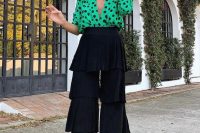 37 a super playful look with a green and black polka dot shirt and tiered ruffle pants plus black heels is a fun idea