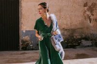40 a winter garden wedding look with a green velvet midi dress, a bit of faux fur, red velvet shoes and a lilac velvet bag