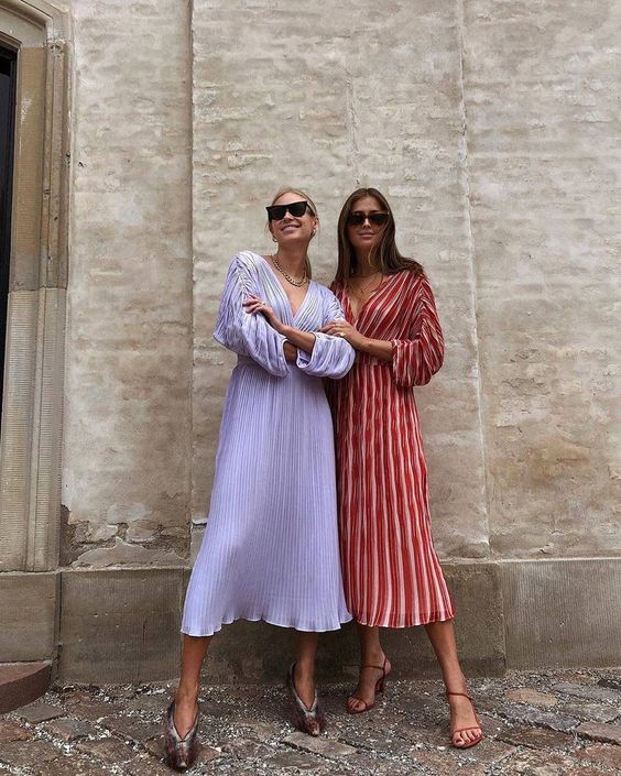 beautiful midi pleated dresses   a lilac one and a red and white striped one, with draped short sleeves and deep plunging necklines