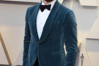 07 Chris Evans wearing a white shirt, a black bow tie and pants, a slate blue velvet dinner jacket for a fresh take on black tie looks