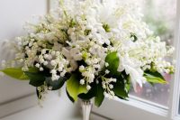 09 a lush wedding bouquet of lily of the vallet, white blooms and foliage and on a silver handle is a beautiful idea for a vintage wedding
