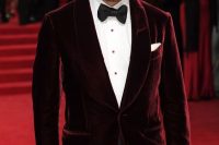 09 an elegant outfit with a white shirt with red buttons, black trousers, a burgundy velvet dinner jacket and a black bow tie