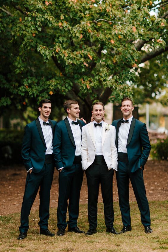 elegant teal tuxedos with black lapels, black bow ties and shoes make up super stylish black tie looks with a twist - the color