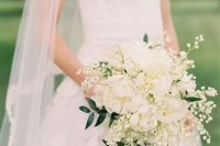 16 a white wedding bouquet of white peonies, lily of the valley and greenery is a lovely idea for a spring or summer bride