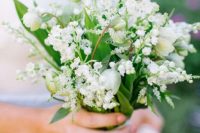 19 an all-white wedding bouquet of lily of the valley, snowdrops, greenery, tulips is a beautiful idea for a spring bride