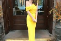 32 a gorgeous yellow one shoulder maxi dress with a small train and no sleeves is a lovely idea to stand out at a black tie wedding