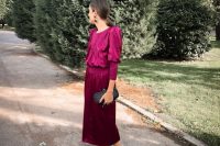 39 a purple midi dress with ribbed touches, accented shoulders, metallic shoes and an embellished black clutch