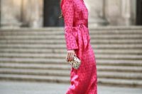 46 a shiny pink printed midi dress with a high neckline, long sleeves and accented shoulders, hot pink shoes and a printed clutch, statement earrings