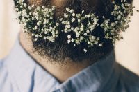 a beard decorated with white baby’s breath is a lovely idea for a spring or summer groom is a chic idea