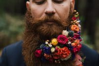 a bold and refined beard with orange, yellow, pink, blue flowers, thistles and berries is a fantastic idea for a jewel-tone wedding