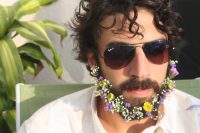 a flower beard with white, lilac and yellow blooms is a lovely touch of color to your neutral groom’s look