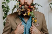 a gorgeous and dimensional beard with orange, red, mauve and yellow blooms and lots of textural greenery is amazing
