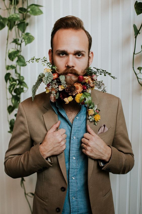 a gorgeous and dimensional beard with orange, red, mauve and yellow blooms and lots of textural greenery is amazing