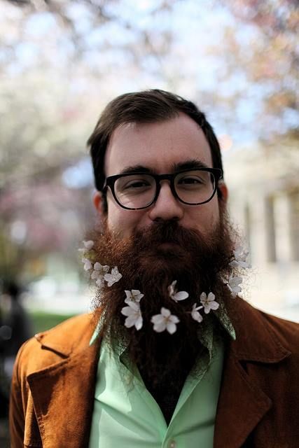 a groom rocking a beard with white cherry blossom looks more spring-like and fresh