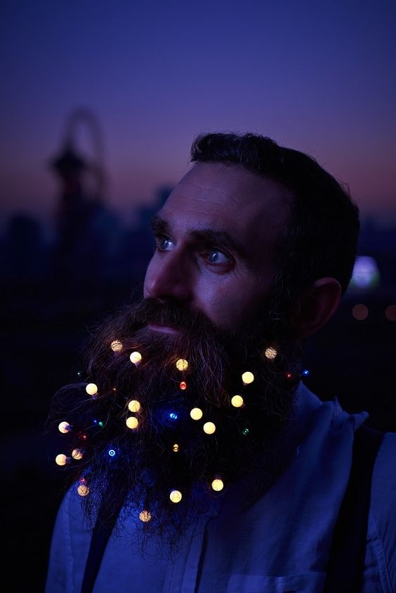 a groom rocking lights in his beard will make a statement, especially in the night time pics
