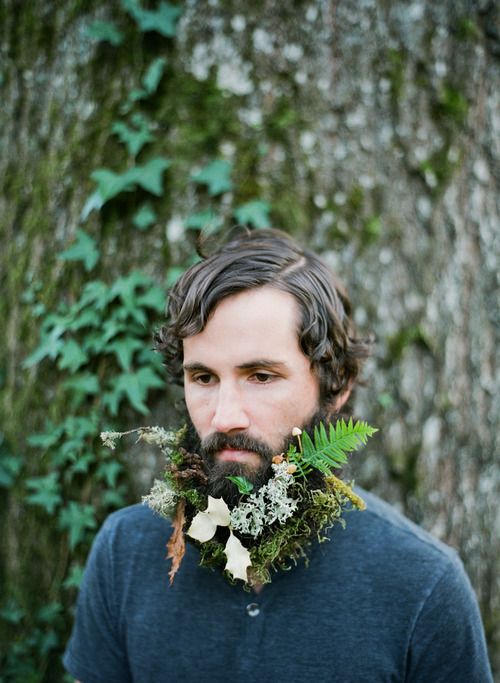 a woodland beard with fern, moss, white blooms and fall leaves is a great for a forest wedding in summer or fall