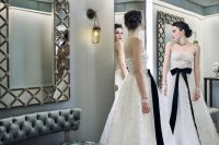 02 a jaw-dropping strapless wedding dress fully covered with pearls and with a black ribbon bow on the waist is a fantastic idea with a girlish feel