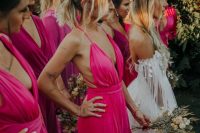 02 fantastic mismatching hot pink and fuchsia maxi bridesmaid dresses are ideal for rocking them at a tropical wedding