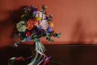 06 this bridal bouquet is a very bold one, with billy balls and colorful pompoms, with long ribbons is amazing for a fun wedding