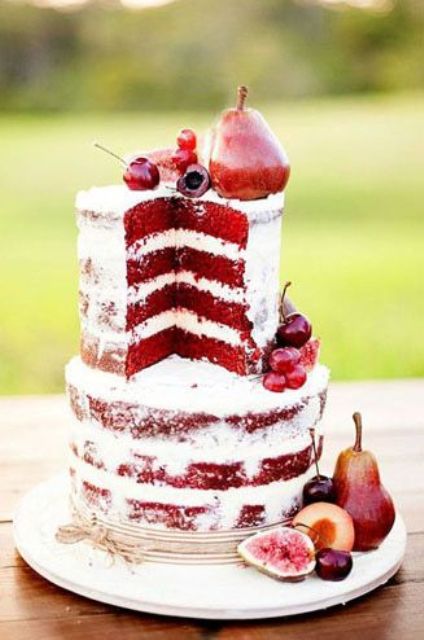 a red velvet naked wedding cake with fresh figs, pears, cherries and other fruit is an amazing idea for a fall boho wedding