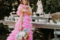 09 a whimsical hot pink A-line tulle wedding dress with a plunging neckline and a tiered skirt with a long train – such dresses are among the hottest current trends