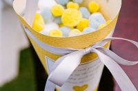 13 a large yellow cone with white, grey and yellow pompoms instead of rice for wedding exit is a very fun and creative idea, later you may reuse them