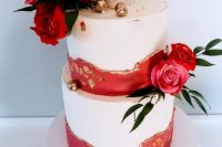 14 a beautiful and chic wedding cake done with red and gold leaf textural touches, pink and red roses and greeenery, gilded cherries on top