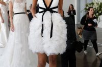 14 a catchy modern knee wedding dress with a plain white bodice with black rim, a ruffle full skirt, black shoes with black lace socks and black earrings by Marchesa