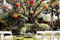 14 a living tree decorated with oversized colorful pompoms instead of blooms is a fresh eco-friendly idea that really works and won’t cost a pretty penny