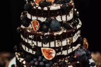 14 a naked chocolate wedding cake with figs, grapes, gilded blackberries and chocolate drip