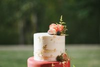 15 a beautiful and chic wedding cake with a naked and a red tier with gold leaf, with pink blooms, berries and a bit of greenery is a refined idea for a fall wedding