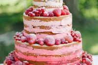 16 a beautiful red and pink naked wedding cake topped with strawberries and raspberries is a gorgeous idea for a boho summer wedding