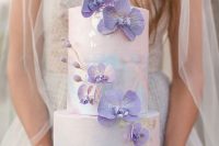 17 a pastel watercolor wedding cake with gold foil and purple orchids covering it is a gorgeous and cool idea to rock
