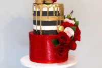 18 a bold and pretty wedding cake with a striped and red tier, with gold drip and gold macarons, pink and red roses and leaves is amazing for a colorful wedding