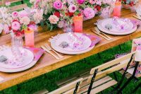18 a bright garden wedding tablescape with light pink chargers and plates, a hot pink and red flower centerpiece, hot pink punch and lemonade