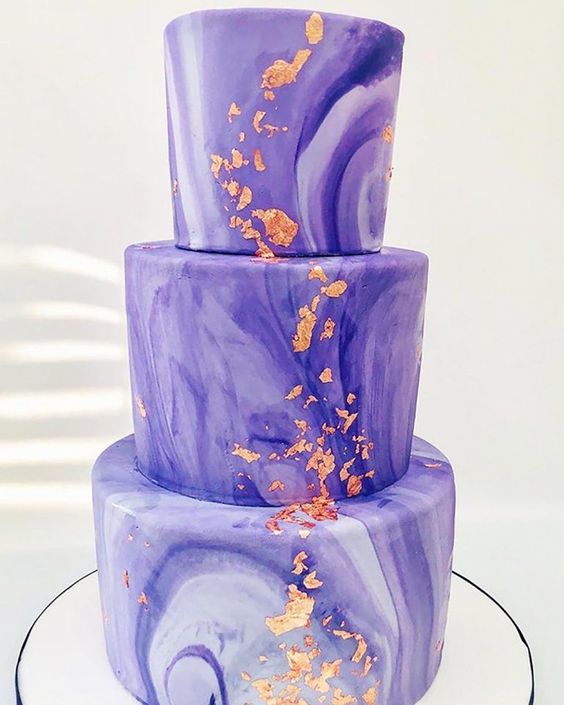 a purple marble wedding cake with copper foil decor is a stylish and bold idea for a modern wedding with purple shades