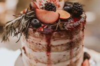 22 a naked wedding cake with berry drip, fresh fruits and berries is a gorgeous idea for a fall wedding
