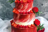 24 a red and white textural wedding cake topped with red roses and greenery and strawberries and rapsberries is a gorgeous idea for a modern wedding