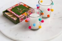 24 accent candleholders with colorful pompoms to give your tablescapes a fun and cool look