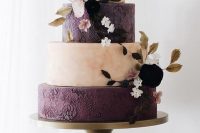 26 a sophisticated pink marble and deep purple flroal pattern wedding cake decorated with blush and deep purple blooms and dried leaves