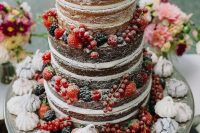 27 a naked wedding cake with lots of berries and meringues is a lovely idea for a rustic wedding