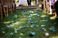 32 use colorful yarn pompoms instead of petals or blooms to line up the aisle and make your wedding unique and cheerful