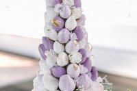 34 a purple and white chocolate dipper strawberry tower with gold brushstrokes and a gold butterfly on top is amazing