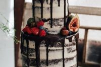 34 semi naked chocolate wedding cake with chocolate drip topped with fruit and berries is amazing for summer or fall