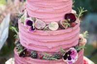 35 a bright pink textural wedding cake with greenery, blooms, fresh berries and mini meringues is a fantastic and chic idea