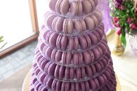 36 an ombre purple wedding macaron tower is a beautiful and cool alternative to a usual wedding cake in purple colors, and it’s usually cheaper
