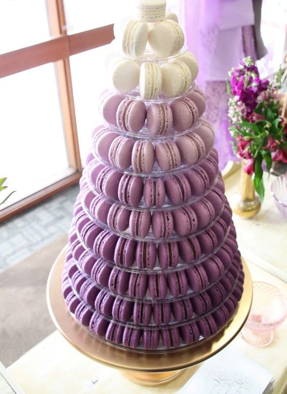 an ombre purple wedding macaron tower is a beautiful and cool alternative to a usual wedding cake in purple colors, and it's usually cheaper