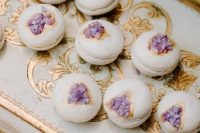 37 fab neutral macarons with purple geodes on top are a lovely alternative to a usual purple wedding cake, or an addition