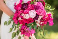 38 a super bright and lovely wedding bouquet of hot pink, purple and fuchsia blooms, with lots of greenery and pink ribbon is amazing