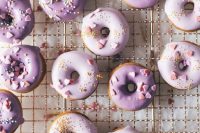 39 gorgeous baked buttermilk frosted mini donuts topped with sugar hearts and confetti are amazing for a purple wedding